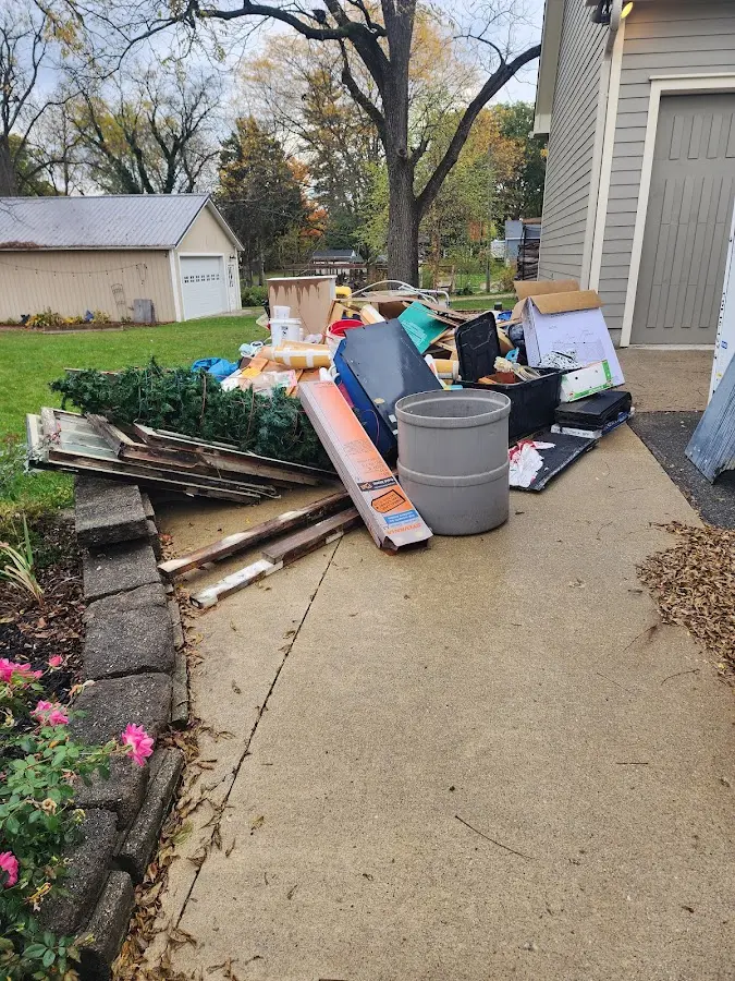 Dumpster being loaded with debris for Demolition Dumpster Rental in Gun Barrel City